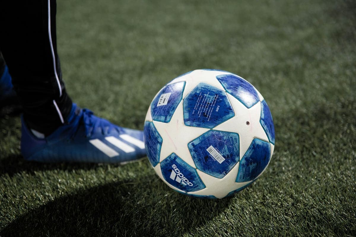 A football on a grass pitch